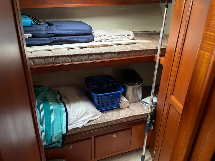 On Course Yacht Photos Pics 1986 Egg Harbor 41 Convertible cabin with bunk beds and storage.