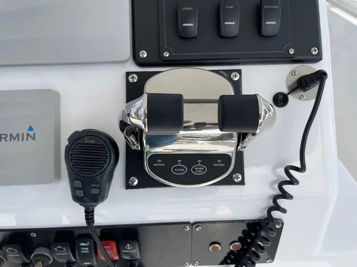 On Course Yacht Photos Pics Control panel of a 1986 Egg Harbor 41 Convertible boat with throttle and microphone.