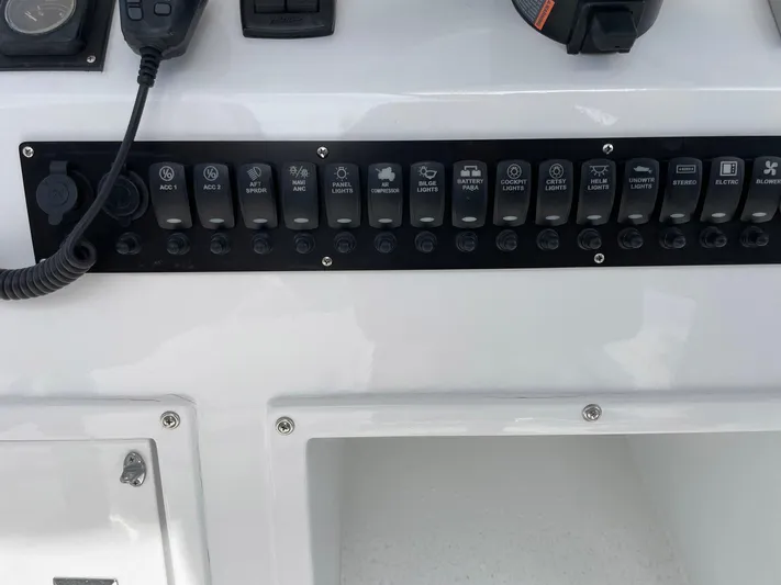 On Course Yacht Photos Pics Control panel of a 1986 Egg Harbor 41 Convertible boat with labeled switches.
