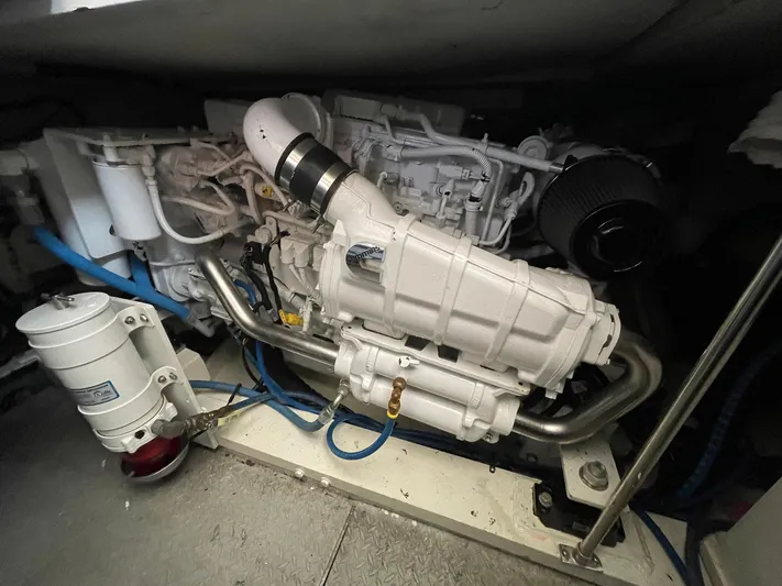 On Course Yacht Photos Pics Engine room of 1986 Egg Harbor 41 Convertible boat, showcasing mechanical components and piping.