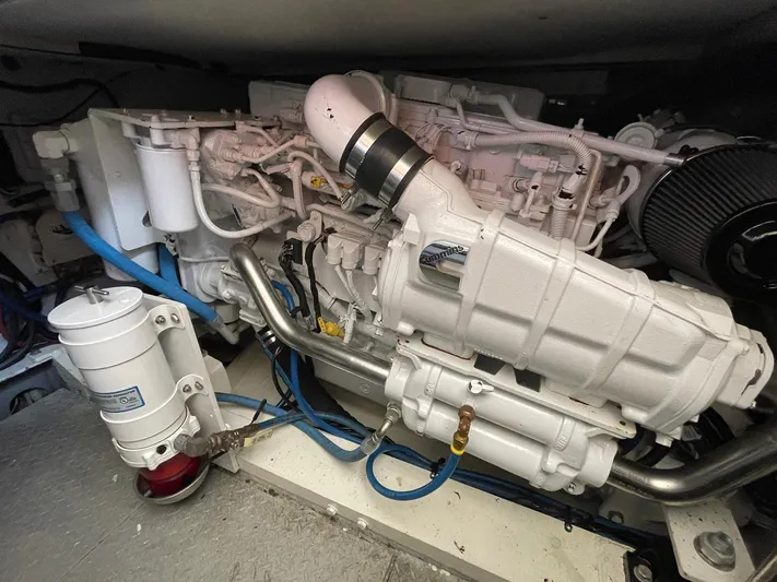 On Course Yacht Photos Pics Engine compartment of a 1986 Egg Harbor 41 Convertible boat, showcasing detailed mechanical components.