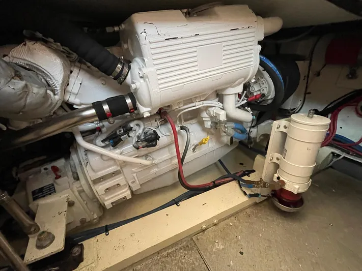 On Course Yacht Photos Pics Engine room of a 1986 Egg Harbor 41 Convertible boat, showcasing mechanical components.