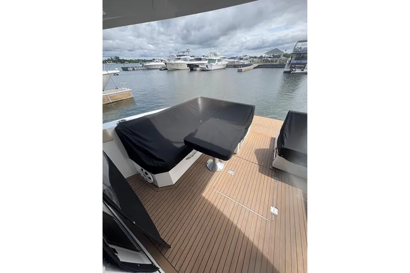  Yacht Photos Pics 2017 Cruisers Yachts 39 Express Coupe, covered seating on deck, marina view.