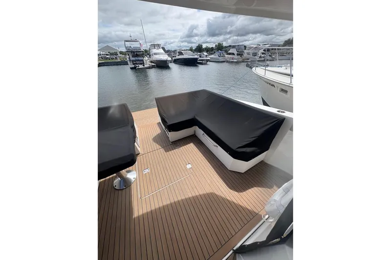  Yacht Photos Pics 2017 Cruisers Yachts 39 Express Coupe deck with covered seating, docked at marina.