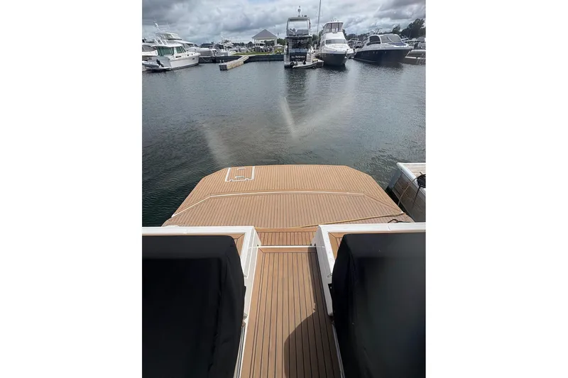  Yacht Photos Pics 2017 Cruisers Yachts 39 Express Coupe at marina, featuring spacious deck and scenic view.