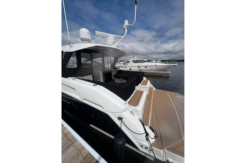  Yacht Photos Pics 2017 Cruisers Yachts 39 Express Coupe docked, showcasing sleek design and spacious deck.