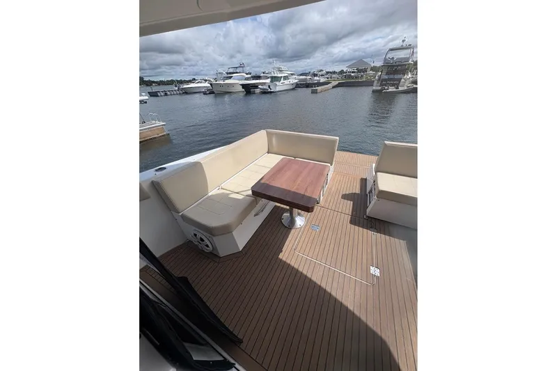  Yacht Photos Pics 2017 Cruisers Yachts 39 Express Coupe with spacious deck and seating area at marina.