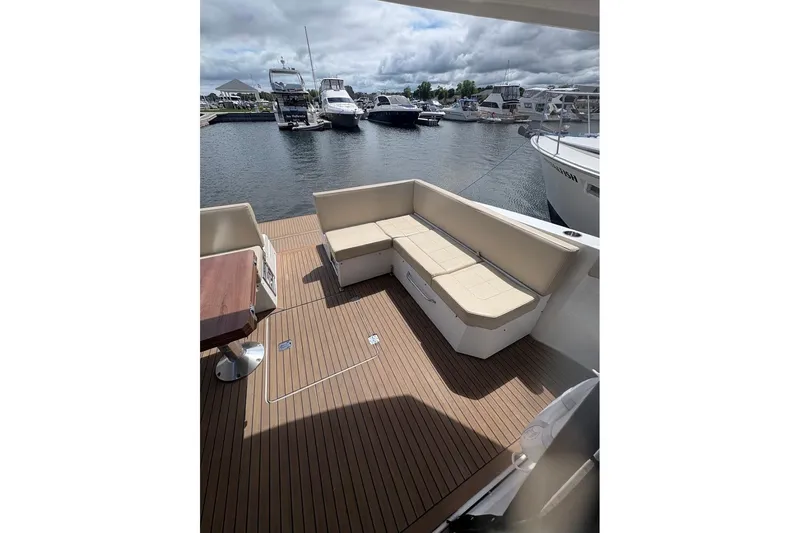  Yacht Photos Pics 2017 Cruisers Yachts 39 Express Coupe with spacious deck seating at marina.