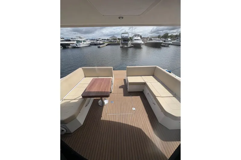  Yacht Photos Pics 2017 Cruisers Yachts 39 Express Coupe with spacious deck and seating at marina.