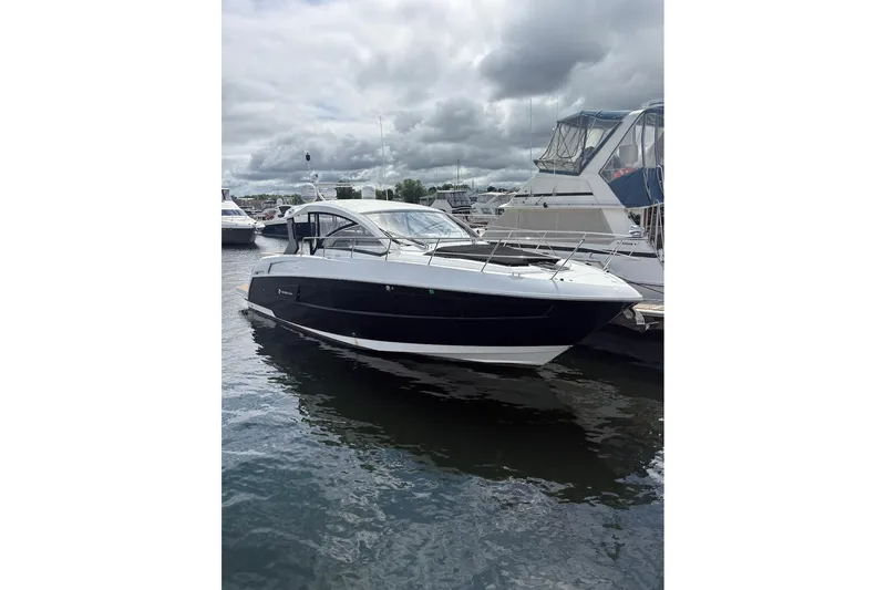  Yacht Photos Pics 2017 Cruisers Yachts 39 Express Coupe docked on a cloudy day.