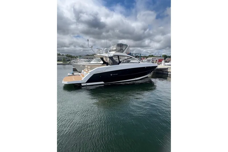  Yacht Photos Pics 2017 Cruisers Yachts 39 Express Coupe docked on a cloudy day.