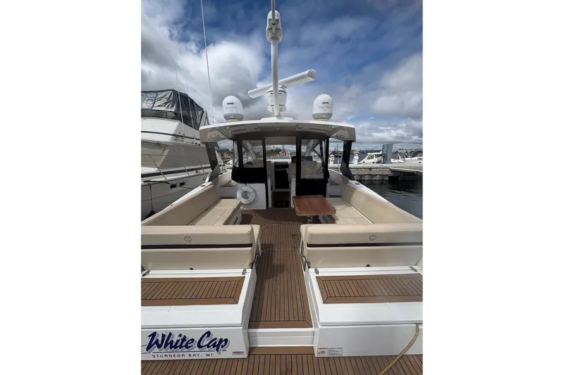  Yacht Photos Pics 2017 Cruisers Yachts 39 Express Coupe docked, featuring spacious seating and modern design.
