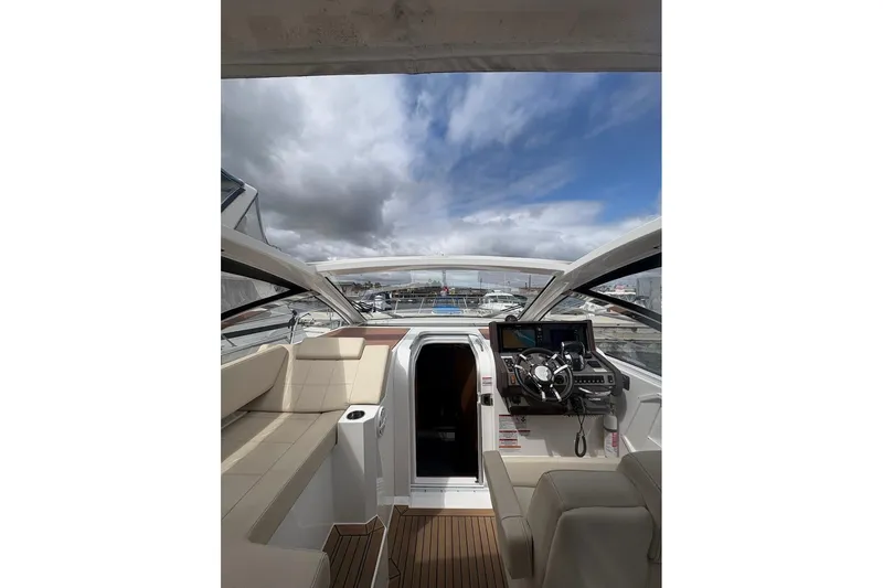  Yacht Photos Pics 2017 Cruisers Yachts 39 Express Coupe interior with helm, seating, and open sky view.