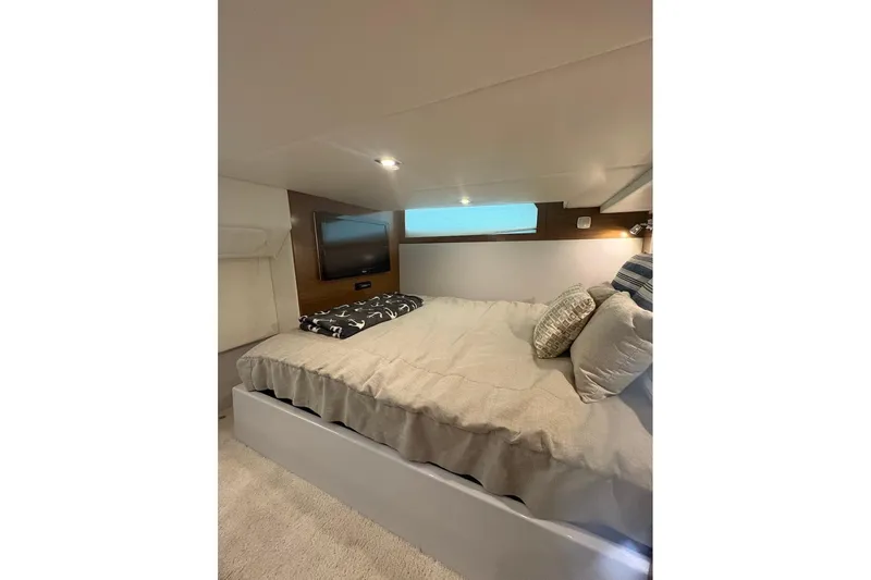  Yacht Photos Pics 2017 Cruisers Yachts 39 Express Coupe cabin with cozy bed and modern decor.