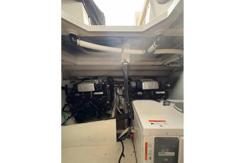  Yacht Photos Pics Engine room of 2017 Cruisers Yachts 39 Express Coupe, showcasing dual engines.