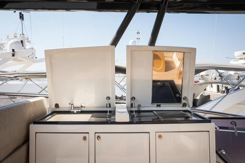 Tyche Yacht Photos Pics 2019 Monte Carlo Yachts MCY 76 outdoor kitchen with grill and sink.