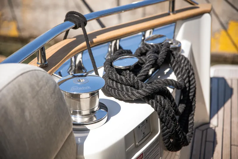 Tyche Yacht Photos Pics Monte Carlo Yachts MCY 76, 2019 model, featuring deck details with ropes and cleats.