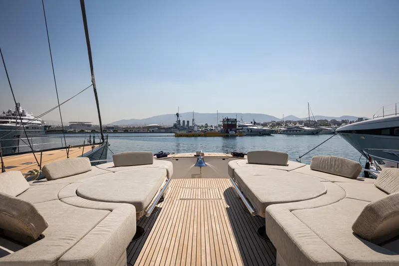 Tyche Yacht Photos Pics Luxurious 2019 Monte Carlo Yachts MCY 76 with spacious deck and scenic harbor view.