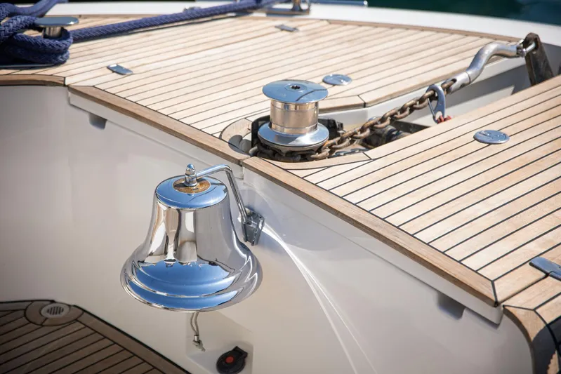 Tyche Yacht Photos Pics 2019 Monte Carlo Yachts MCY 76 deck with bell and anchor chain detail.