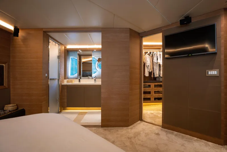 Tyche Yacht Photos Pics Luxurious interior of 2019 Monte Carlo Yachts MCY 76 with ensuite bathroom and closet.