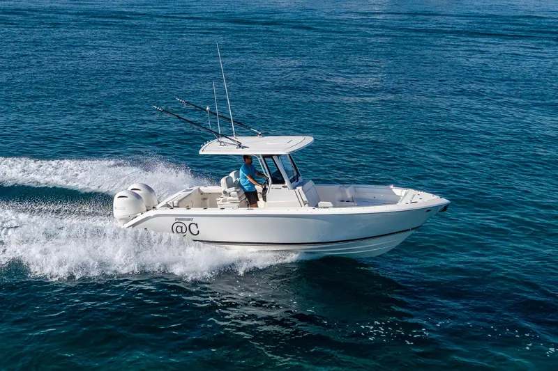 @c Yacht Photos Pics 2022 Pursuit S 268 Sport boat cruising on open water.
