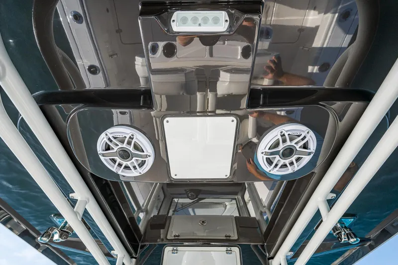 @c Yacht Photos Pics 2022 Pursuit S 268 Sport boat interior with speakers and lighting fixtures.