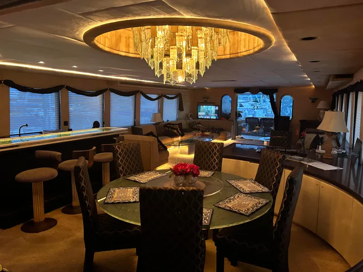 Entrepeneur Yacht Photos Pics Luxurious interior of a 1992 Christensen motor yacht with elegant dining area and chandelier.