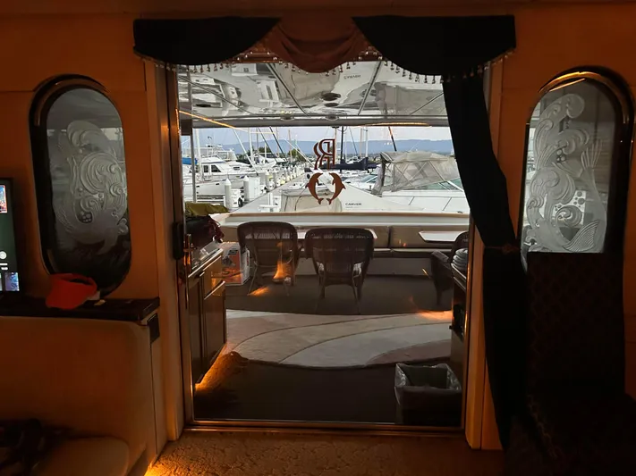 Entrepeneur Yacht Photos Pics Luxurious interior view of a 1992 Christensen motor yacht with marina backdrop.