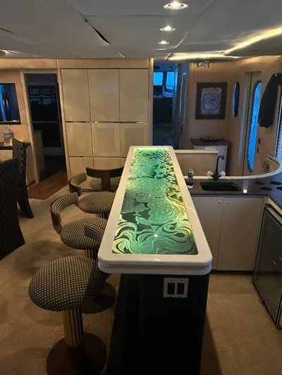 Entrepeneur Yacht Photos Pics Luxurious 1992 Christensen motor yacht interior with elegant bar and stylish seating.