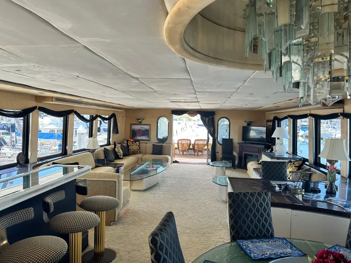 Entrepeneur Yacht Photos Pics Luxurious interior of a 1992 Christensen motor yacht with elegant seating and large windows.