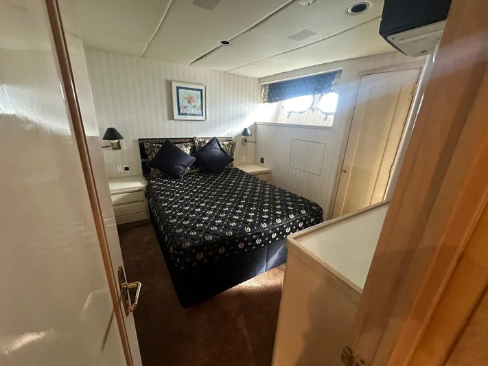 Entrepeneur Yacht Photos Pics Luxurious bedroom on 1992 Christensen Motor Yacht with elegant decor and natural light.