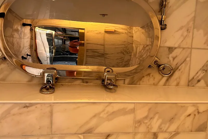 Entrepeneur Yacht Photos Pics Marble bathroom interior with oval mirror on Christensen Motor Yacht, 1992 model.