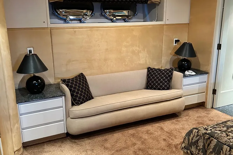 Entrepeneur Yacht Photos Pics Luxurious 1992 Christensen motor yacht interior with beige sofa, black lamps, and elegant decor.