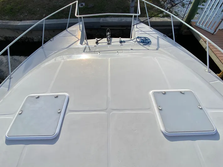  Yacht Photos Pics Deck view of 1995 Mares 58 Power Cat with hatches and railing.