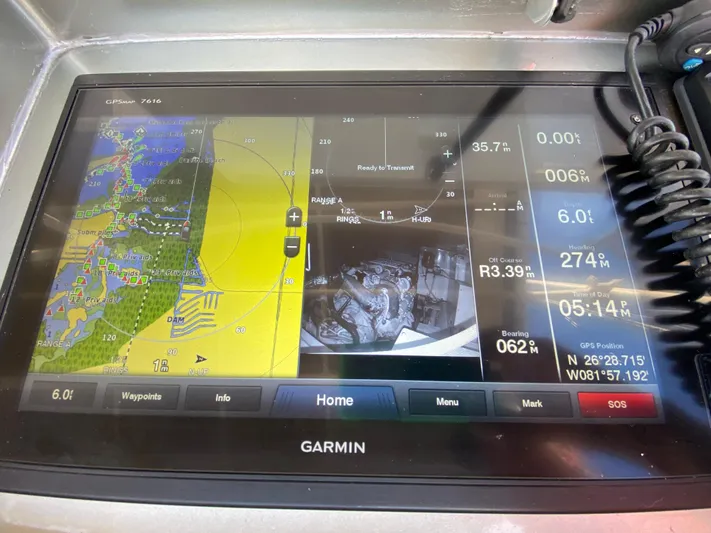  Yacht Photos Pics Garmin navigation display on 1995 Mares 58 Power Cat, showing maps and vessel data.