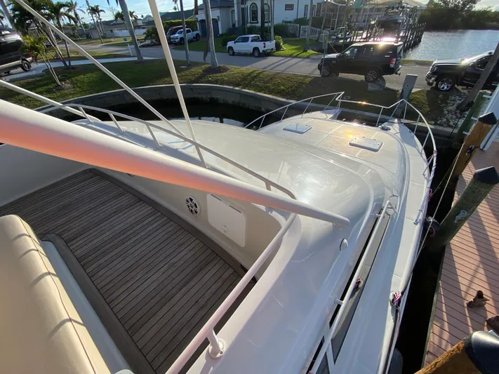  Yacht Photos Pics 1995 Mares 58 Power Cat docked, showcasing sleek design and spacious deck.