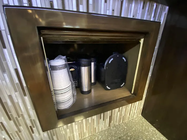  Yacht Photos Pics Storage compartment with cups and thermoses on a Mares 58 Power Cat, 1995 model.