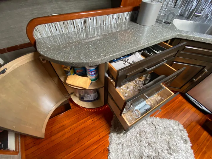  Yacht Photos Pics Kitchen area of a 1995 Mares 58 Power Cat with open cabinets and drawers.