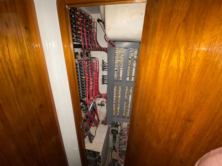  Yacht Photos Pics Electrical panel inside 1995 Mares 58 Power Cat, showcasing wiring and circuit components.