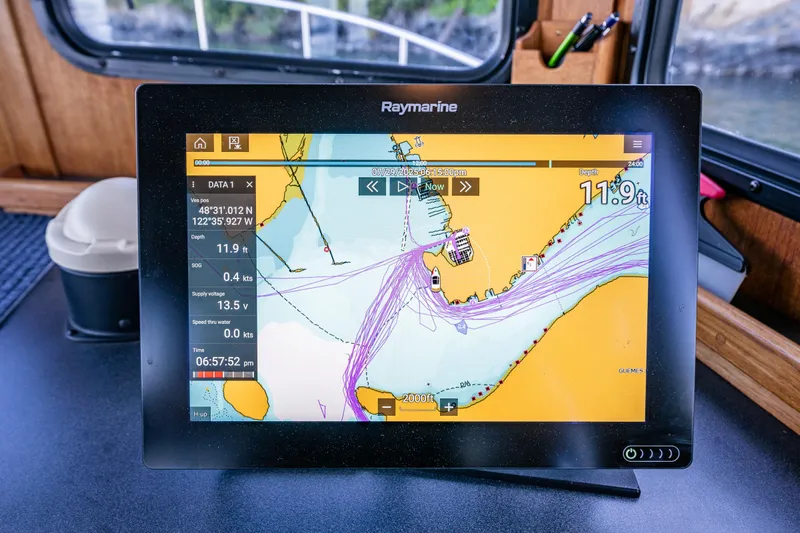 Naukati II Yacht Photos Pics Raymarine navigation display on 2000 Nordic Tug 32, showing nautical chart and vessel data.