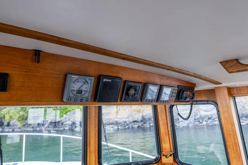 Naukati II Yacht Photos Pics Interior view of a 2000 Nordic Tug 32 boat dashboard with navigation instruments.