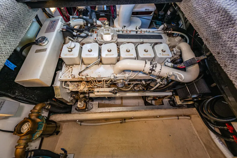 Naukati II Yacht Photos Pics Engine compartment of a 2000 Nordic Tug 32, showcasing detailed mechanical components.