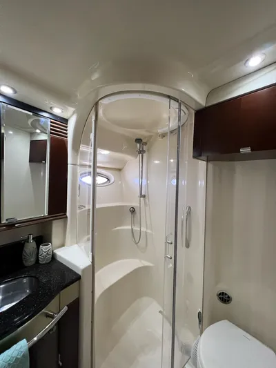  Yacht Photos Pics Luxurious bathroom in 2005 Sea Ray 500 Sedan Bridge yacht with modern shower and sleek design.