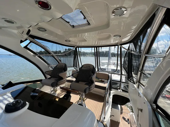  Yacht Photos Pics Interior of 2005 Sea Ray 500 Sedan Bridge yacht with panoramic windows and luxurious seating.
