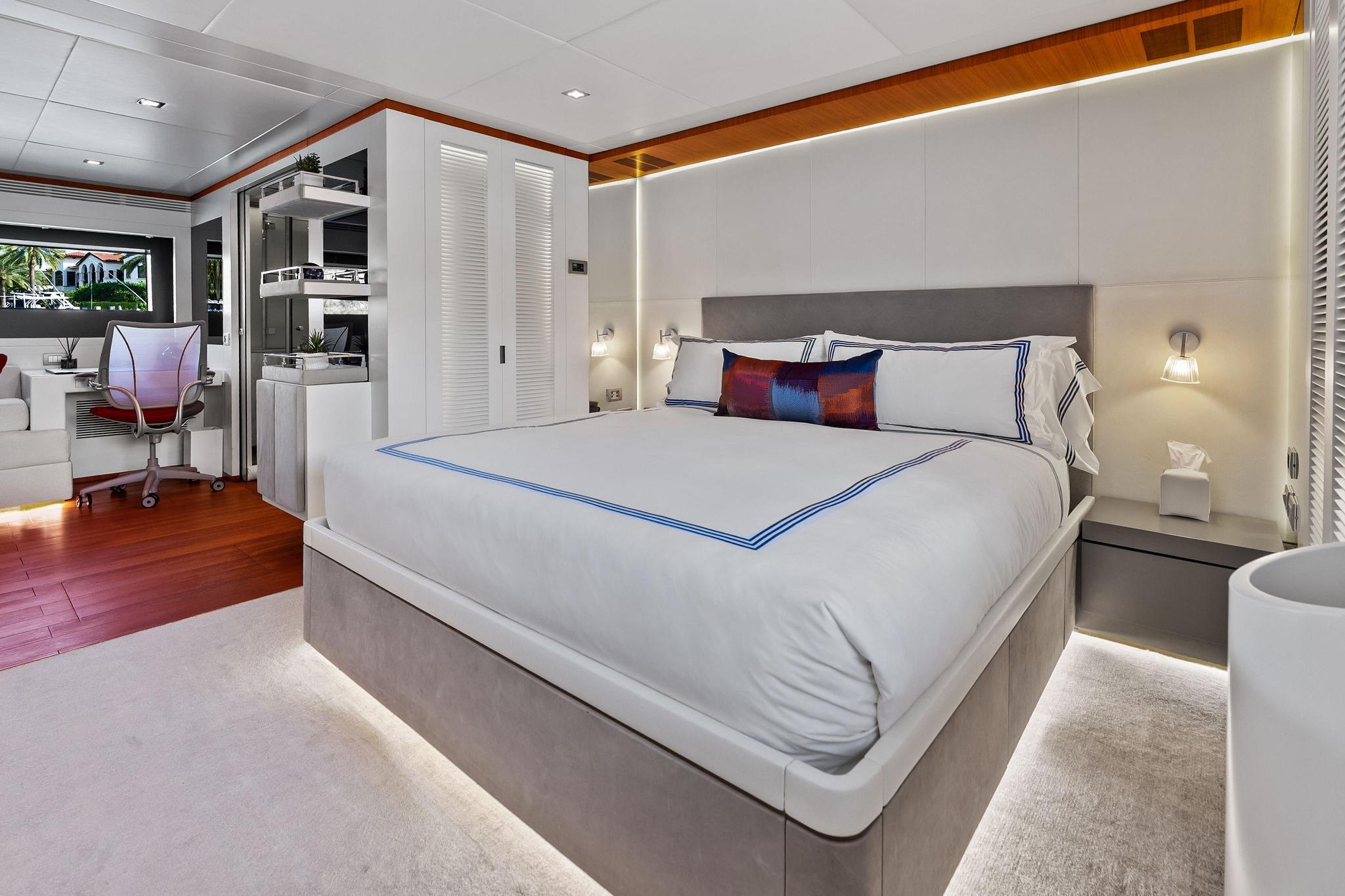 Luxurious bedroom interior on 2013 AB 116 Motoryacht with modern decor and elegant furnishings.