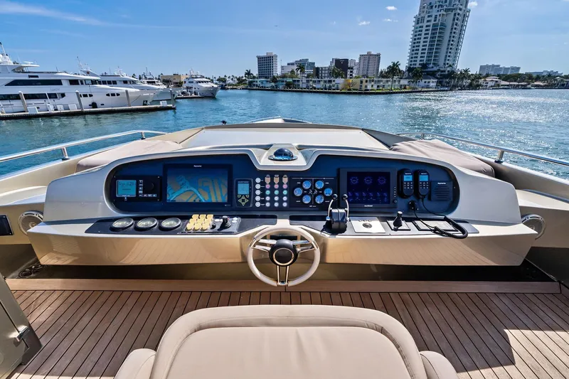 Diamond Yacht Photos Pics Helm of 2013 AB 116 Motoryacht with modern controls, docked in a scenic marina.