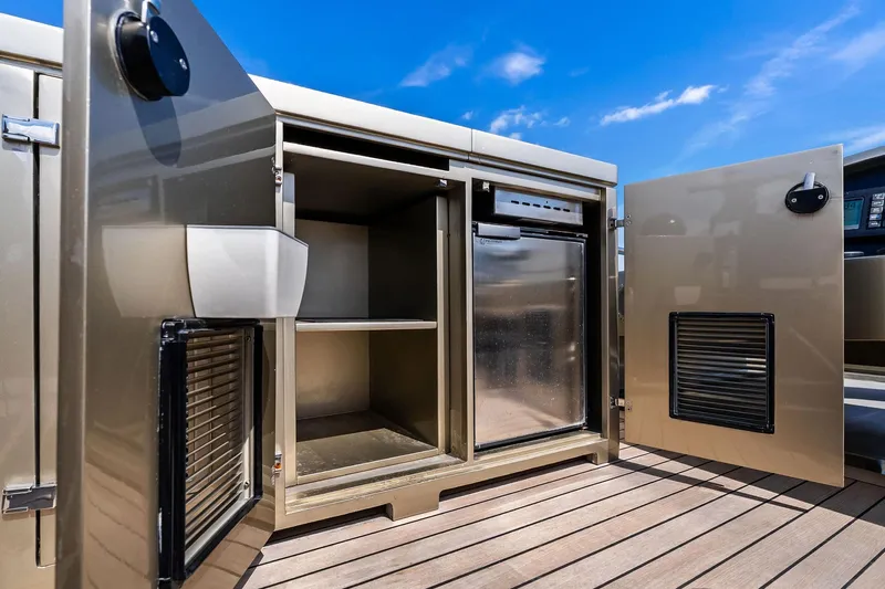 Diamond Yacht Photos Pics Open storage compartments on 2013 AB 116 Motoryacht deck under clear blue sky.