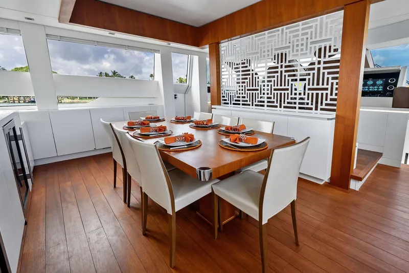 Diamond Yacht Photos Pics Luxurious dining area on 2013 AB 116 Motoryacht with elegant table setting and modern decor.