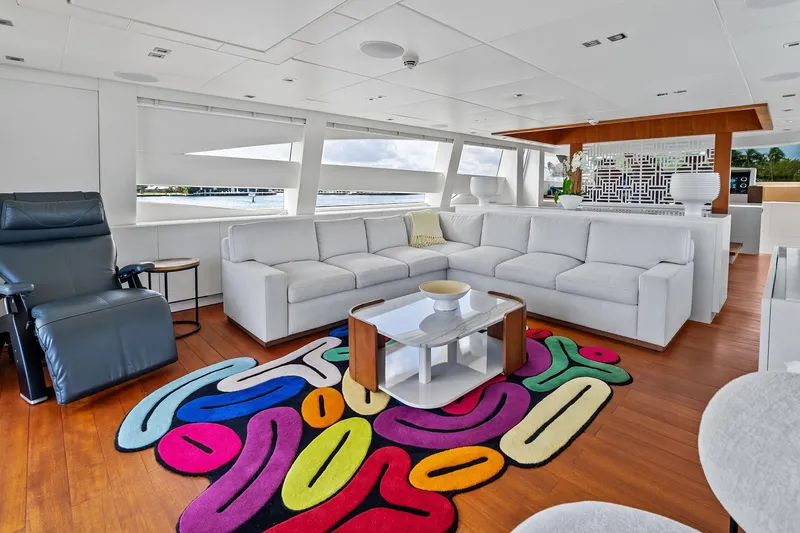 Diamond Yacht Photos Pics Luxurious interior of 2013 AB 116 Motoryacht with modern decor and colorful rug.