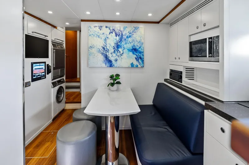 Diamond Yacht Photos Pics Modern interior of 2013 AB 116 Motoryacht with dining area and kitchen amenities.